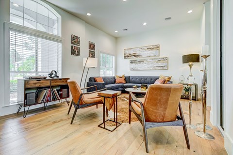 a living room with a couch and a table with chairs